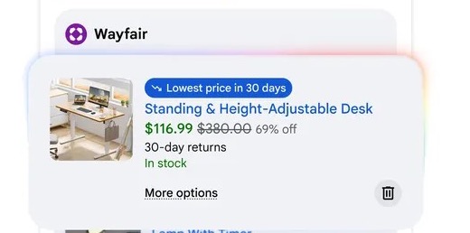 Google AI Mode Can Wait for a Deal: Is It Actually Cheaper? A desk offer with a lowest-price-in-30-days badge in Google’s official Universal Cart illustration
